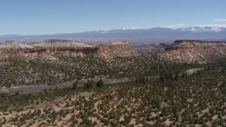 5.7K aerial stock footage of flying away from desert mesas in New Mexico Aerial Stock Footage | DX0002_133_007