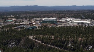 DX0002_133_028 - 5.7K aerial stock footage wide view of the Los Alamos National Laboratory during descent, New Mexico