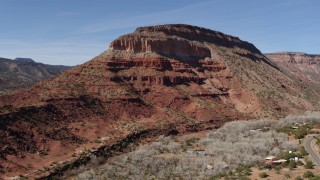 5.7K aerial stock footage of orbiting a large butte with steep slopes, New Mexico Aerial Stock Footage | DX0002_135_005