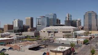 5.7K aerial stock footage of passing the arena near office buildings in Downtown Phoenix, Arizona Aerial Stock Footage | DX0002_136_001