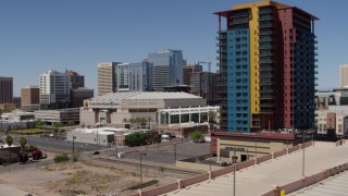 5.7K aerial stock footage of flying away from the arena and reveal condo complex in Downtown Phoenix, Arizona Aerial Stock Footage | DX0002_136_009