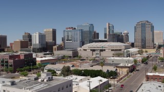 5.7K aerial stock footage of slowly flying away from the arena and office buildings in Downtown Phoenix, Arizona Aerial Stock Footage | DX0002_136_011