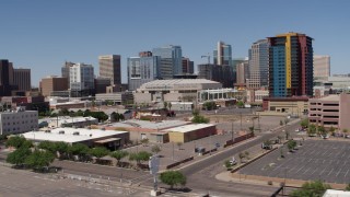 5.7K aerial stock footage of slowly flying past from the arena and office buildings, reveal condo complex in Downtown Phoenix, Arizona Aerial Stock Footage | DX0002_136_012