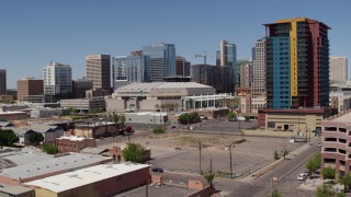 5.7K aerial stock footage of a slow pass by the arena and reveal the condo complex in Downtown Phoenix, Arizona Aerial Stock Footage | DX0002_136_015