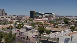 5.7K aerial stock footage of condominium complex and baseball stadium seen during decent, Downtown Phoenix, Arizona Aerial Stock Footage | DX0002_136_039