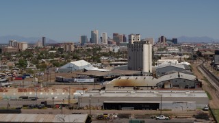 5.7K aerial stock footage of the city's skyline seen from a grain elevator in Downtown Phoenix, Arizona Aerial Stock Footage | DX0002_136_049