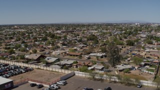 5.7K aerial stock footage of descending near urban homes in Phoenix, Arizona Aerial Stock Footage | DX0002_137_015