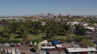 5.7K aerial stock footage of a wide view of the city's skyline while approaching cemetery in Downtown Phoenix, Arizona Aerial Stock Footage | DX0002_137_019