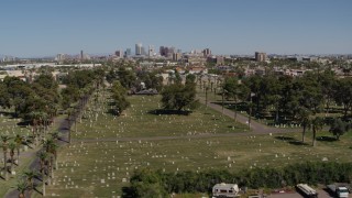 5.7K aerial stock footage of a reverse view of the city's skyline from cemetery in Downtown Phoenix, Arizona Aerial Stock Footage | DX0002_137_021