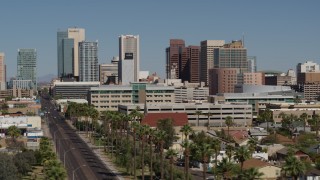 5.7K aerial stock footage of tall office buildings seen from Van Buren Street in Downtown Phoenix, Arizona Aerial Stock Footage | DX0002_137_049