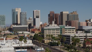 DX0002_137_050 - 5.7K aerial stock footage slow approach to tall office buildings, seen from Van Buren Street in Downtown Phoenix, Arizona