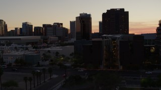 5.7K aerial stock footage of flying by college buildings at sunset for view of office buildings in Downtown Phoenix, Arizona Aerial Stock Footage | DX0002_139_003