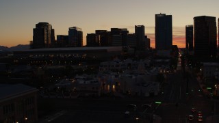 5.7K aerial stock footage fly toward and past tall office high-rises at sunset in Downtown Phoenix, Arizona Aerial Stock Footage | DX0002_139_013