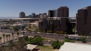 DX0002_140_006 - 5.7K aerial stock footage flyby city's skyline to reveal college buildings in Downtown Phoenix, Arizona