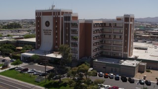 DX0002_140_025 - 5.7K aerial stock footage orbit a hospital complex before descending in Phoenix, Arizona