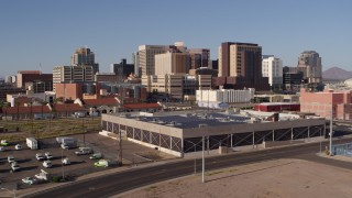 5.7K aerial stock footage of the city's skyline seen while flying past train station in Downtown Phoenix, Arizona Aerial Stock Footage | DX0002_142_017