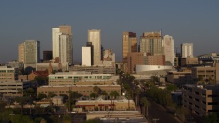 5.7K aerial stock footage reverse view of skyline at sunset, descend near Adams Street Downtown Phoenix, Arizona Aerial Stock Footage | DX0002_143_026