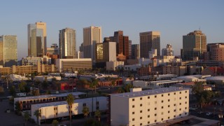 DX0002_143_030 - 5.7K aerial stock footage of a view of the city's skyline at sunset, Downtown Phoenix, Arizona