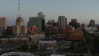 5.7K aerial stock footage of a view of the Westward Ho building and tall office towers at sunset, Downtown Phoenix, Arizona Aerial Stock Footage | DX0002_143_047