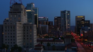 5.7K aerial stock footage flyby tall office buildings, and reveal Westward Ho building at twilight, Downtown Phoenix, Arizona Aerial Stock Footage | DX0002_143_059