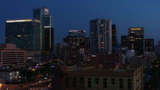 5.7K aerial stock footage reverse view of high-rise office buildings, reveal Westward Ho building at twilight, Downtown Phoenix, Arizona Aerial Stock Footage | DX0002_143_062