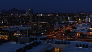 5.7K aerial stock footage of circling a glass office building at twilight, Downtown Phoenix, Arizona Aerial Stock Footage | DX0002_143_066