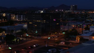 5.7K aerial stock footage orbit and approach glass office building at twilight, Downtown Phoenix, Arizona Aerial Stock Footage | DX0002_143_067