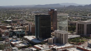 5.7K aerial stock footage of flying by tall high-rise office towers, Downtown Tucson, Arizona Aerial Stock Footage | DX0002_144_024