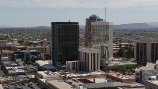 5.7K aerial stock footage of tall high-rise office towers seen during descent, Downtown Tucson, Arizona Aerial Stock Footage | DX0002_144_025