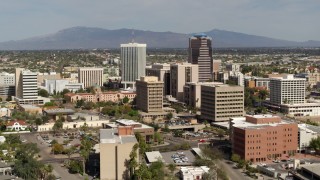 5.7K aerial stock footage of flying past tall high-rise office towers, city buildings in Downtown Tucson, Arizona Aerial Stock Footage | DX0002_144_029