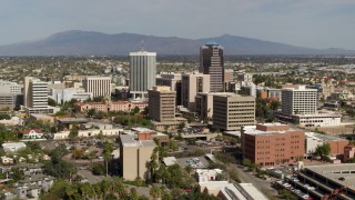 5.7K aerial stock footage approach tall office high-rises surrounded by city buildings in Downtown Tucson, Arizona Aerial Stock Footage | DX0002_144_036