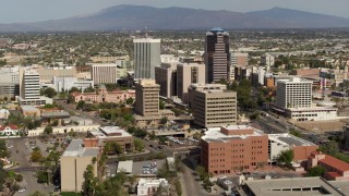 5.7K aerial stock footage flyby tall office high-rises and city buildings, then descend, Downtown Tucson, Arizona Aerial Stock Footage | DX0002_144_041