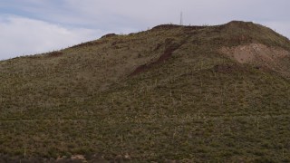 5.7K aerial stock footage approach Sentinel Peak with cactus plants and radio tower in Tucson, Arizona Aerial Stock Footage | DX0002_145_009