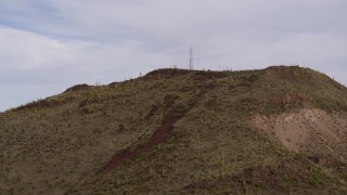 DX0002_145_010 - 5.7K aerial stock footage approach radio tower on top of Sentinel Peak in Tucson, Arizona