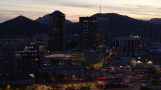 5.7K aerial stock footage slowly circling tall office towers at sunset, Downtown Tucson, Arizona Aerial Stock Footage | DX0002_147_026