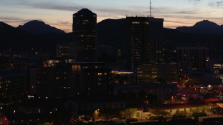 5.7K aerial stock footage orbiting three towering office buildings at twilight, Downtown Tucson, Arizona Aerial Stock Footage | DX0002_147_037