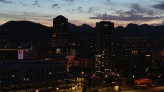 5.7K aerial stock footage a reverse view of two towering office buildings at twilight, Downtown Tucson, Arizona Aerial Stock Footage | DX0002_147_038