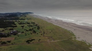 4K aerial stock footage of flying toward people on the beach in Long Beach, Washington Aerial Stock Footage | DX0002_148_018