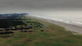 4K aerial stock footage a wide view of beach and ocean waves at sunset in Long Beach, Washington Aerial Stock Footage | DX0002_148_027