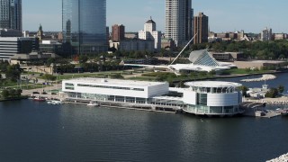 DX0002_149_010 - 5.7K aerial stock footage of orbiting Discovery World museum in Downtown Milwaukee, Wisconsin