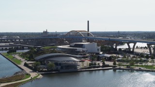 DX0002_149_019 - 5.7K aerial stock footage of flying away from two concert venues in Downtown Milwaukee, Wisconsin