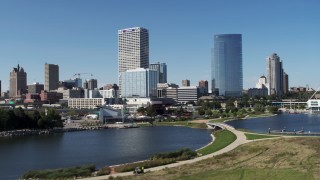 DX0002_149_020 - 5.7K aerial stock footage of city buildings near the water in Downtown Milwaukee, Wisconsin