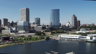 5.7K aerial stock footage of the waterfront museum near city buildings in Downtown Milwaukee, Wisconsin Aerial Stock Footage | DX0002_149_024