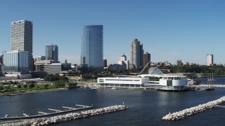 5.7K aerial stock footage of flying near the waterfront museum with a view of city buildings in Downtown Milwaukee, Wisconsin Aerial Stock Footage | DX0002_149_025