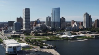 5.7K aerial stock footage of tall skyscrapers seen from Discover World museum in Downtown Milwaukee, Wisconsin Aerial Stock Footage | DX0002_149_027