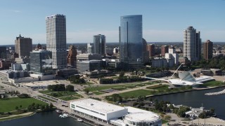 5.7K aerial stock footage of tall skyscrapers seen while flying near Discover World museum in Downtown Milwaukee, Wisconsin Aerial Stock Footage | DX0002_149_028