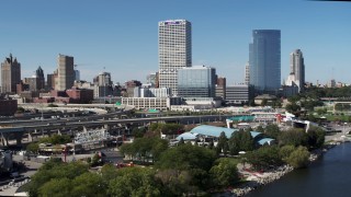 5.7K aerial stock footage of tall skyscrapers seen while descending near an outdoor stage in Downtown Milwaukee, Wisconsin Aerial Stock Footage | DX0002_149_030