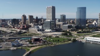 5.7K aerial stock footage of a view of tall skyscrapers seen from Milwaukee Bay, Downtown Milwaukee, Wisconsin Aerial Stock Footage | DX0002_149_032