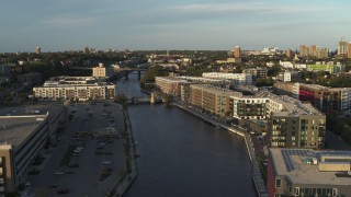 5.7K aerial stock footage apartment complexes by the Milwaukee River at sunset, Milwaukee, Wisconsin Aerial Stock Footage | DX0002_150_023