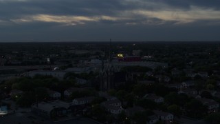 5.7K aerial stock footage of ascending away from church steeples at twilight, Milwaukee, Wisconsin Aerial Stock Footage | DX0002_150_036